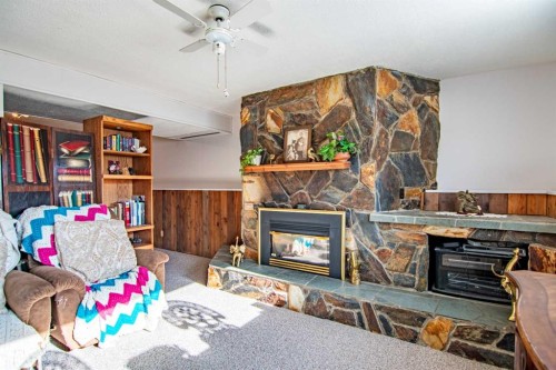 84 Pearson Crescent, Red Deer, AB - Indoor Photo Showing Living Room With Fireplace
