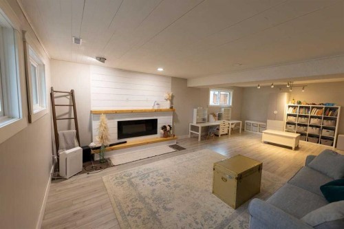10620 103 Street Close, Fairview, AB - Indoor Photo Showing Living Room With Fireplace