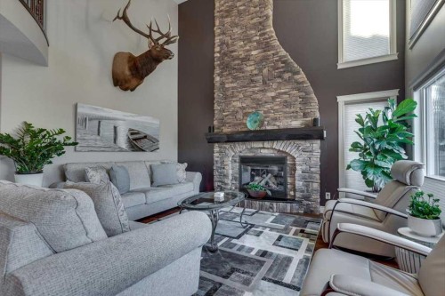 38 Estella Crescent, Lacombe, AB - Indoor Photo Showing Living Room With Fireplace