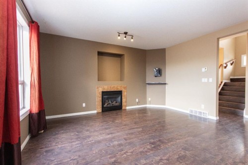 152 Oswald Close, Red Deer, AB - Indoor Photo Showing Other Room With Fireplace