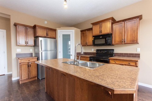 152 Oswald Close, Red Deer, AB - Indoor Photo Showing Kitchen With Double Sink