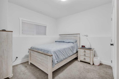 98 Village Crescent, Red Deer, AB - Indoor Photo Showing Bedroom
