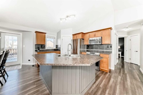 37 Heartland Crescent, Penhold, AB - Indoor Photo Showing Kitchen With Double Sink