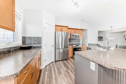 37 Heartland Crescent, Penhold, AB - Indoor Photo Showing Kitchen With Double Sink With Upgraded Kitchen