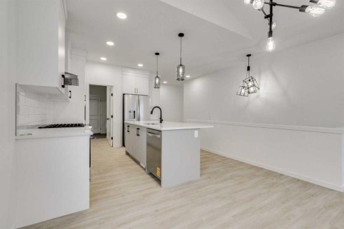 75 Fireside Common, Cochrane, AB - Indoor Photo Showing Kitchen With Upgraded Kitchen