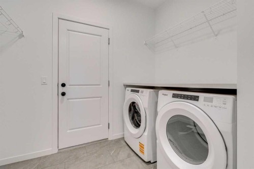 75 Fireside Common, Cochrane, AB - Indoor Photo Showing Laundry Room