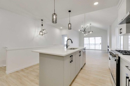 75 Fireside Common, Cochrane, AB - Indoor Photo Showing Kitchen With Upgraded Kitchen