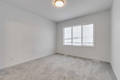 75 Fireside Common, Cochrane, AB - Indoor Photo Showing Other Room