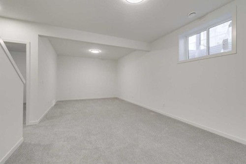 75 Fireside Common, Cochrane, AB - Indoor Photo Showing Other Room