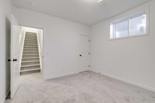 75 Fireside Common, Cochrane, AB - Indoor Photo Showing Other Room