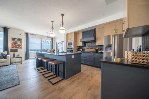 199 Langwell Common Se, Airdrie, AB - Indoor Photo Showing Kitchen With Stainless Steel Kitchen With Upgraded Kitchen