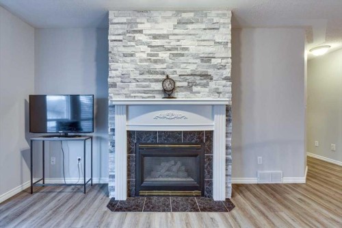 14 Lawrence Crescent, Red Deer, AB - Indoor Photo Showing Living Room With Fireplace