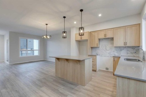 101-81 Midtown Boulevard Sw, Airdrie, AB - Indoor Photo Showing Kitchen With Double Sink
