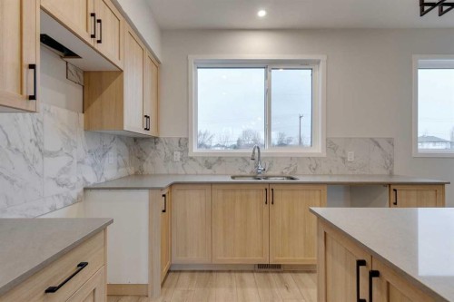 101-81 Midtown Boulevard Sw, Airdrie, AB - Indoor Photo Showing Kitchen With Double Sink