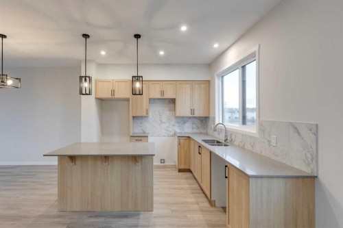 101-81 Midtown Boulevard Sw, Airdrie, AB - Indoor Photo Showing Kitchen With Double Sink