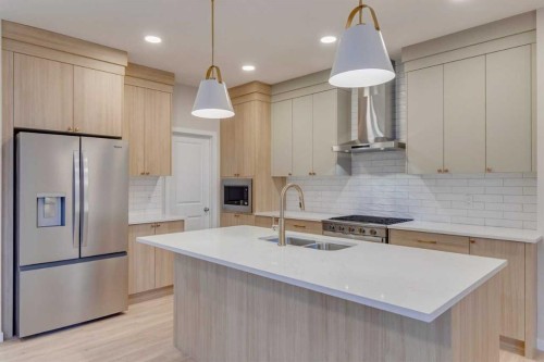 82 Alpine Common Sw, Calgary, AB - Indoor Photo Showing Kitchen With Double Sink With Upgraded Kitchen