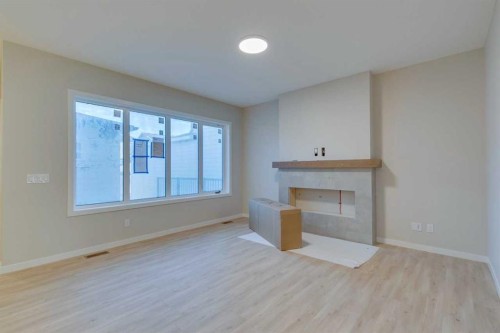 82 Alpine Common Sw, Calgary, AB - Indoor With Fireplace
