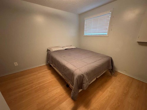 A & B-4923 53 Street, Rocky Mountain House, AB - Indoor Photo Showing Bedroom