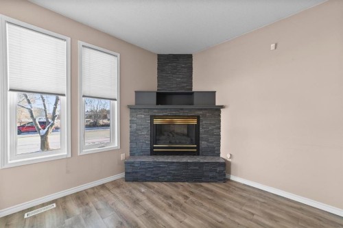5220 47 Street, Camrose, AB - Indoor Photo Showing Living Room With Fireplace