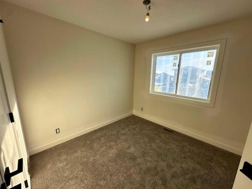 80 Oxford Boulevard, Penhold, AB - Indoor Photo Showing Other Room