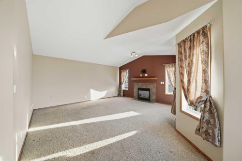 9 Thomas Place, Red Deer, AB - Indoor Photo Showing Other Room With Fireplace