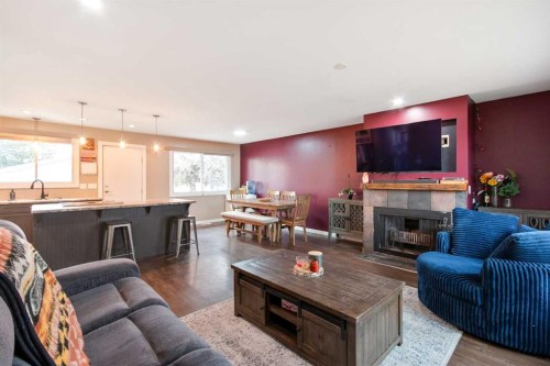 5209 42 Street, Olds, AB - Indoor Photo Showing Living Room With Fireplace