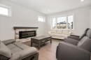6319 26 Avenue, Camrose, AB  - Indoor Photo Showing Living Room With Fireplace 