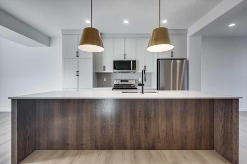 46 Irvin Way, Sylvan Lake, AB - Indoor Photo Showing Kitchen With Upgraded Kitchen