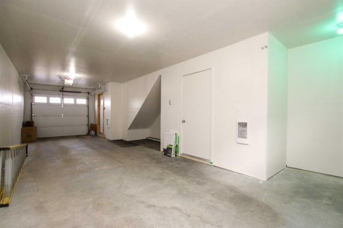 404-125 Caribou Crescent, Red Deer, AB - Indoor Photo Showing Garage