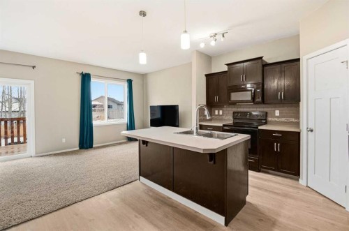 1-5301 Windward Place, Sylvan Lake, AB - Indoor Photo Showing Kitchen With Double Sink