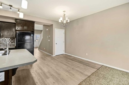 1-5301 Windward Place, Sylvan Lake, AB - Indoor Photo Showing Kitchen With Double Sink