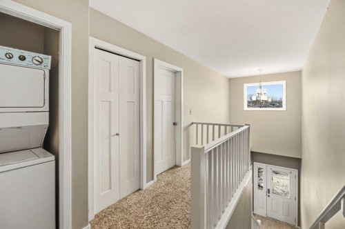 1-5301 Windward Place, Sylvan Lake, AB - Indoor Photo Showing Laundry Room