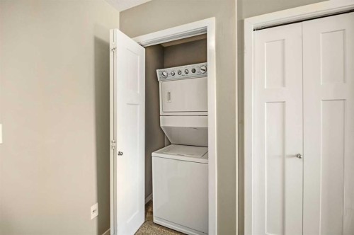 1-5301 Windward Place, Sylvan Lake, AB - Indoor Photo Showing Laundry Room
