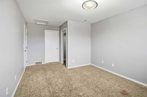 1-5301 Windward Place, Sylvan Lake, AB - Indoor Photo Showing Other Room
