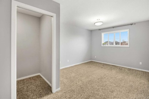 1-5301 Windward Place, Sylvan Lake, AB - Indoor Photo Showing Other Room