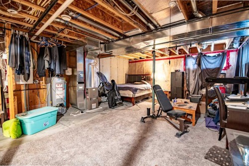 1-5301 Windward Place, Sylvan Lake, AB - Indoor Photo Showing Basement