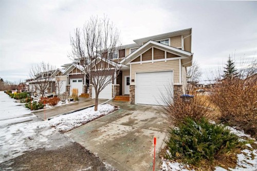 1-5301 Windward Place, Sylvan Lake, AB - Outdoor With Facade