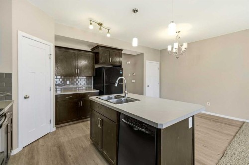 1-5301 Windward Place, Sylvan Lake, AB - Indoor Photo Showing Kitchen With Double Sink