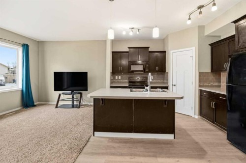 1-5301 Windward Place, Sylvan Lake, AB - Indoor Photo Showing Kitchen With Double Sink