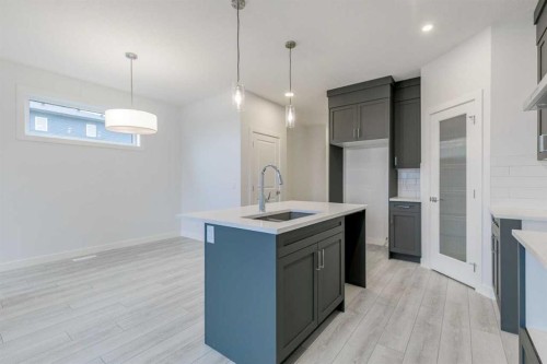 205 Bridgeport Gate, Chestermere, AB - Indoor Photo Showing Kitchen With Upgraded Kitchen