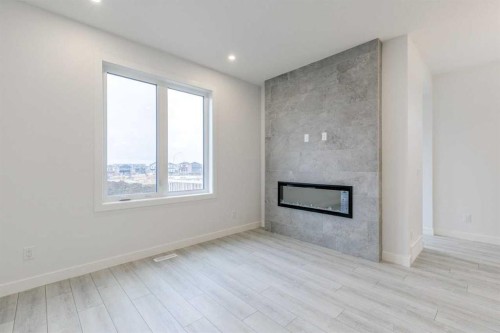205 Bridgeport Gate, Chestermere, AB - Indoor With Fireplace