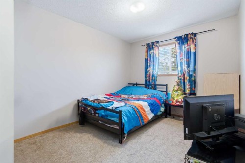 598-100 Jordan Parkway, Red Deer, AB - Indoor Photo Showing Bedroom