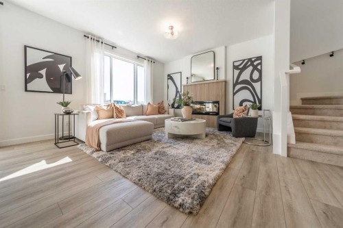 136 Versant Point Sw, Calgary, AB - Indoor Photo Showing Living Room