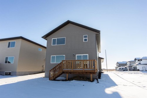 260 Augustus Way, Penhold, AB - Outdoor With Deck Patio Veranda With Exterior
