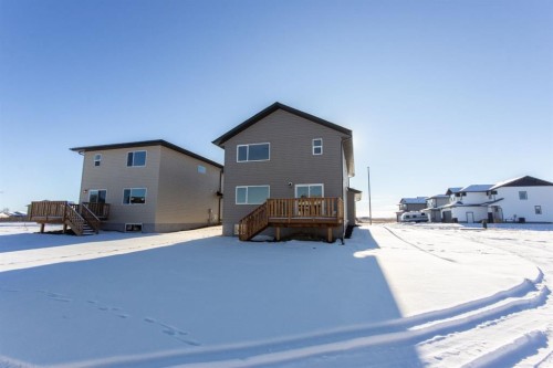 260 Augustus Way, Penhold, AB - Outdoor With Deck Patio Veranda With Exterior