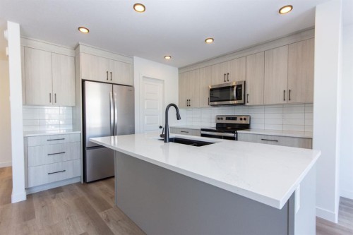 260 Augustus Way, Penhold, AB - Indoor Photo Showing Kitchen With Stainless Steel Kitchen With Upgraded Kitchen