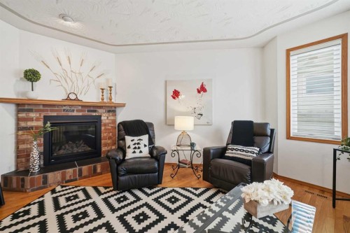 108 Dunham Close, Red Deer, AB - Indoor Photo Showing Living Room With Fireplace