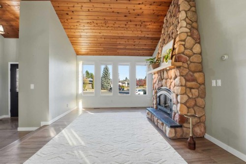 30 Comfort Close, Red Deer, AB - Indoor Photo Showing Other Room With Fireplace