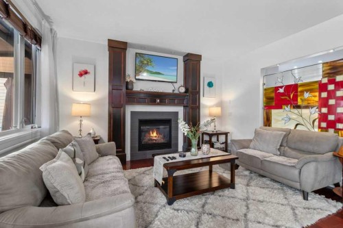 20 Oakfield Close, Red Deer, AB - Indoor Photo Showing Living Room With Fireplace
