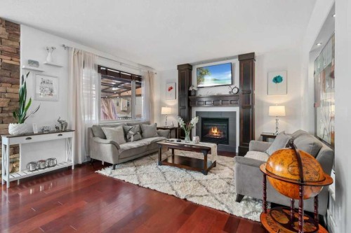 20 Oakfield Close, Red Deer, AB - Indoor Photo Showing Living Room With Fireplace